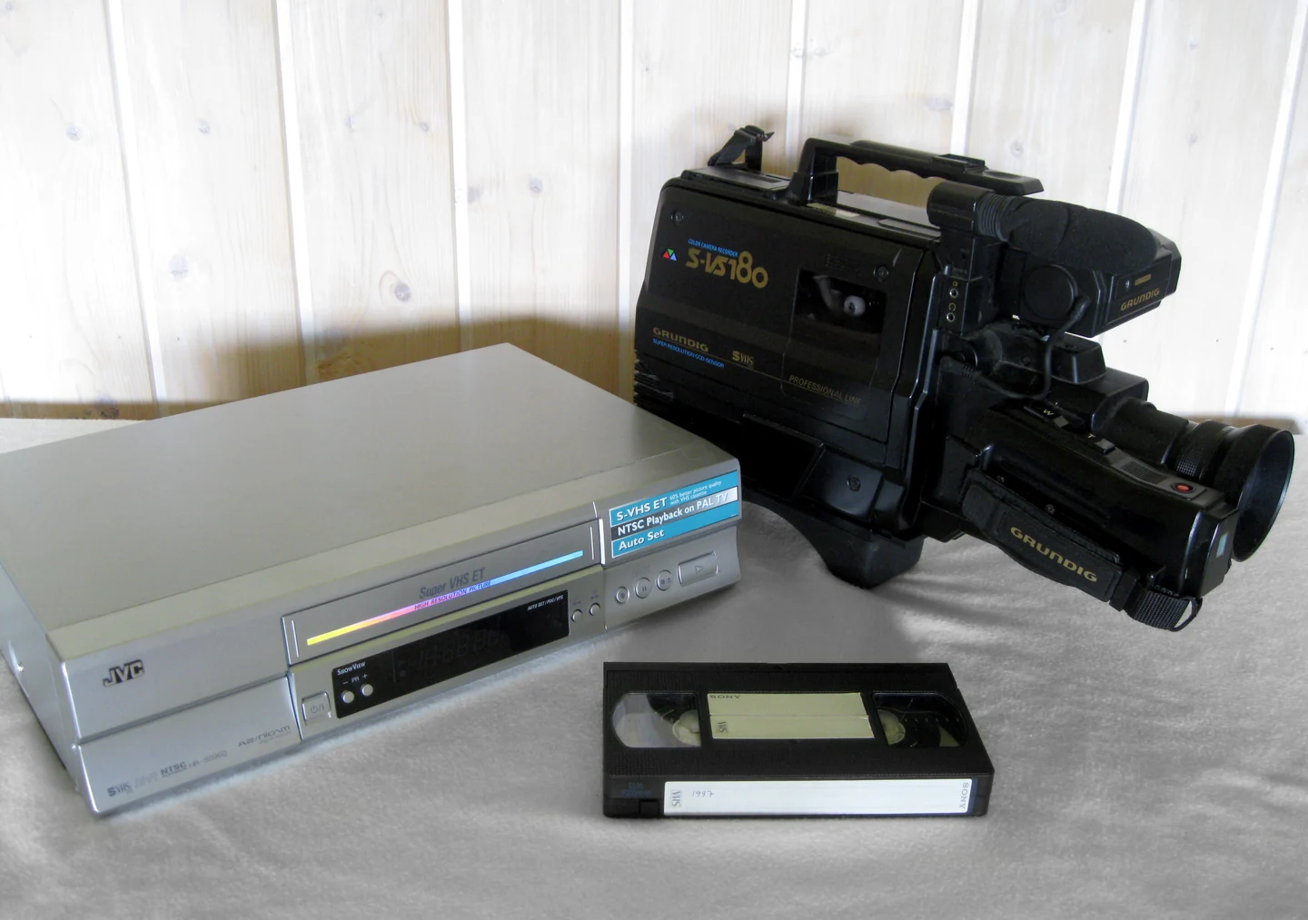 A VHS recorder, camcorder and cassette photographed in 2016; contextual equipment, not Amanda game or film props