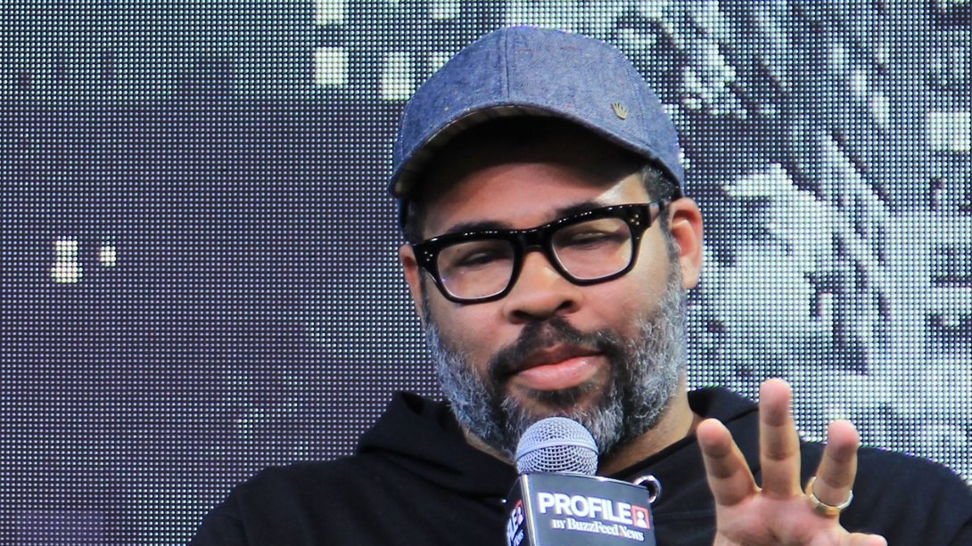 Jordan Peele speaking onstage at SXSW in 2019
