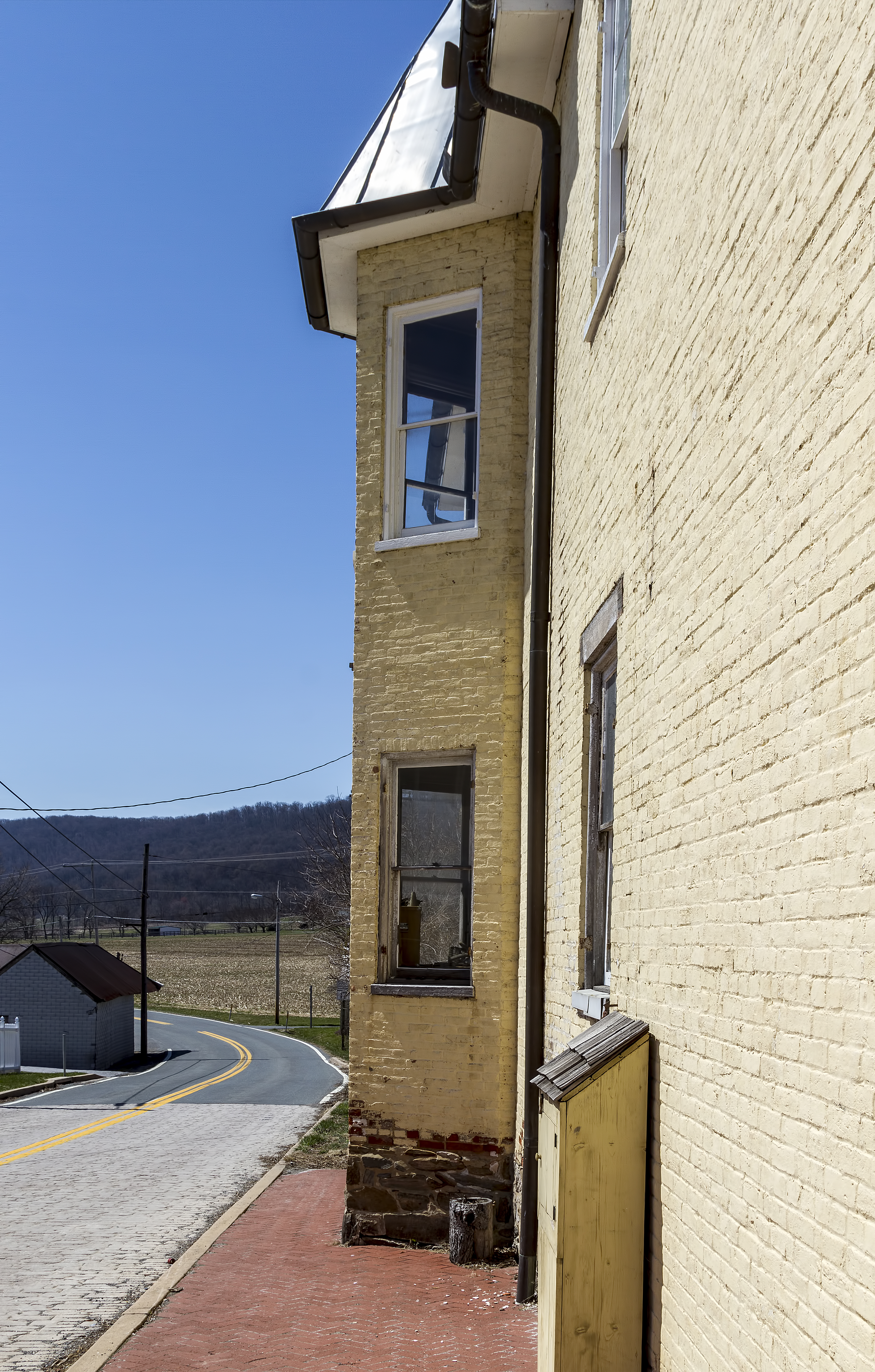 A historic brick building in Burkittsville, Maryland's historic district