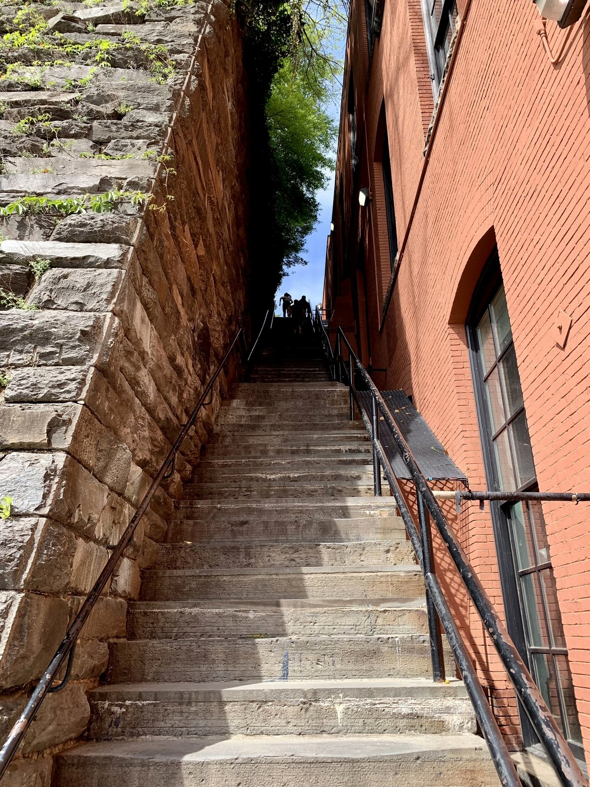 The steep Exorcist steps in Georgetown, Washington, D.C., photographed in 2022; real franchise-location context, not a confirmed Martyrs filming location