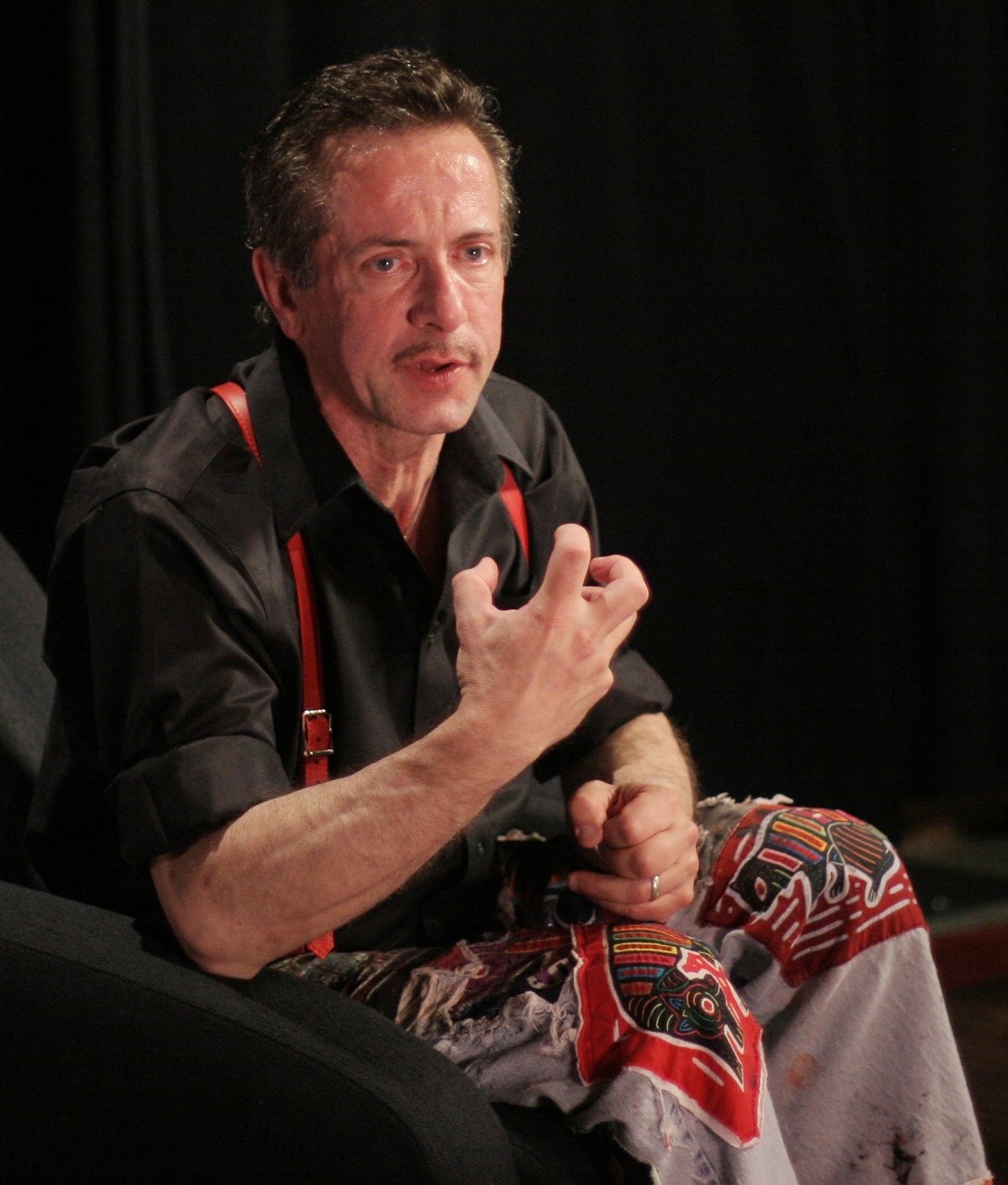 Clive Barker seated and gesturing while speaking at the EMP/Sci-Fi Museum in Seattle in 2007