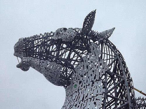Close-up detail of one of the Falkirk Kelpies sculptures, showing the horse head's steel lattice structure