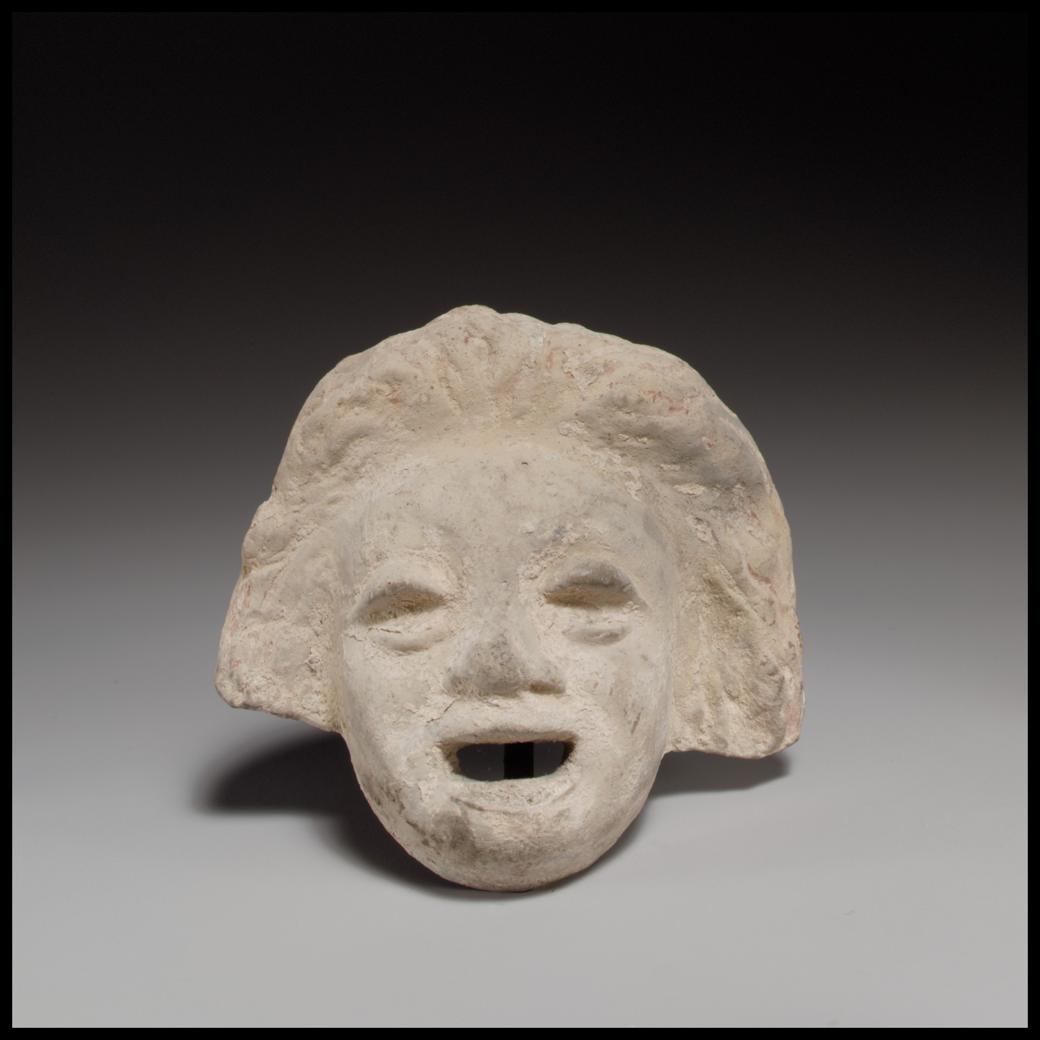 Terracotta comic theatrical mask from Cyprus, Early Hellenistic period, Metropolitan Museum of Art