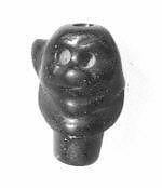 Small serpentine bead carved in the shape of a Pazuzu head