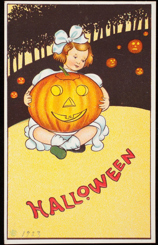 An American Halloween postcard from about 1923 to 1925 showing a girl holding a jack-o'-lantern