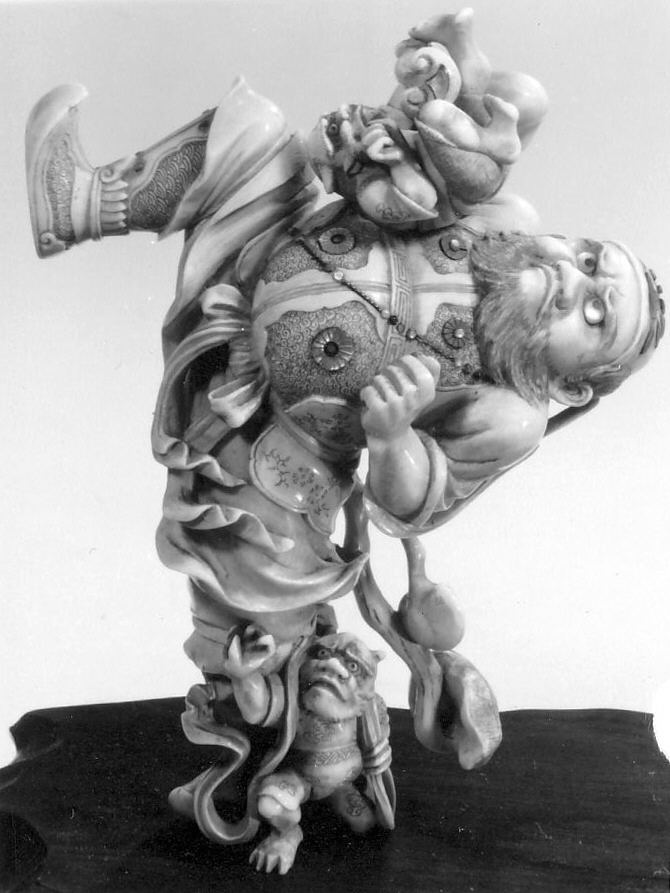 Late 19th-century Japanese ivory sculpture of the demon-queller Shoki standing over two small oni