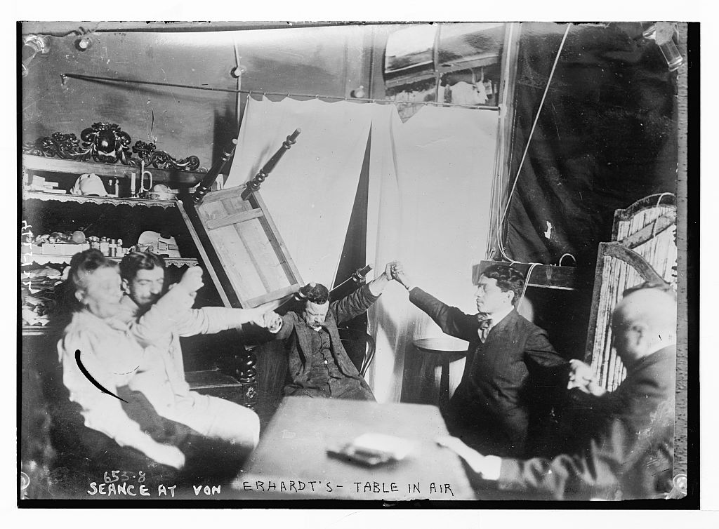 1909 Bain News Service photograph titled Seance at von Erhardt's - Table in the air, showing a raised table among seated participants