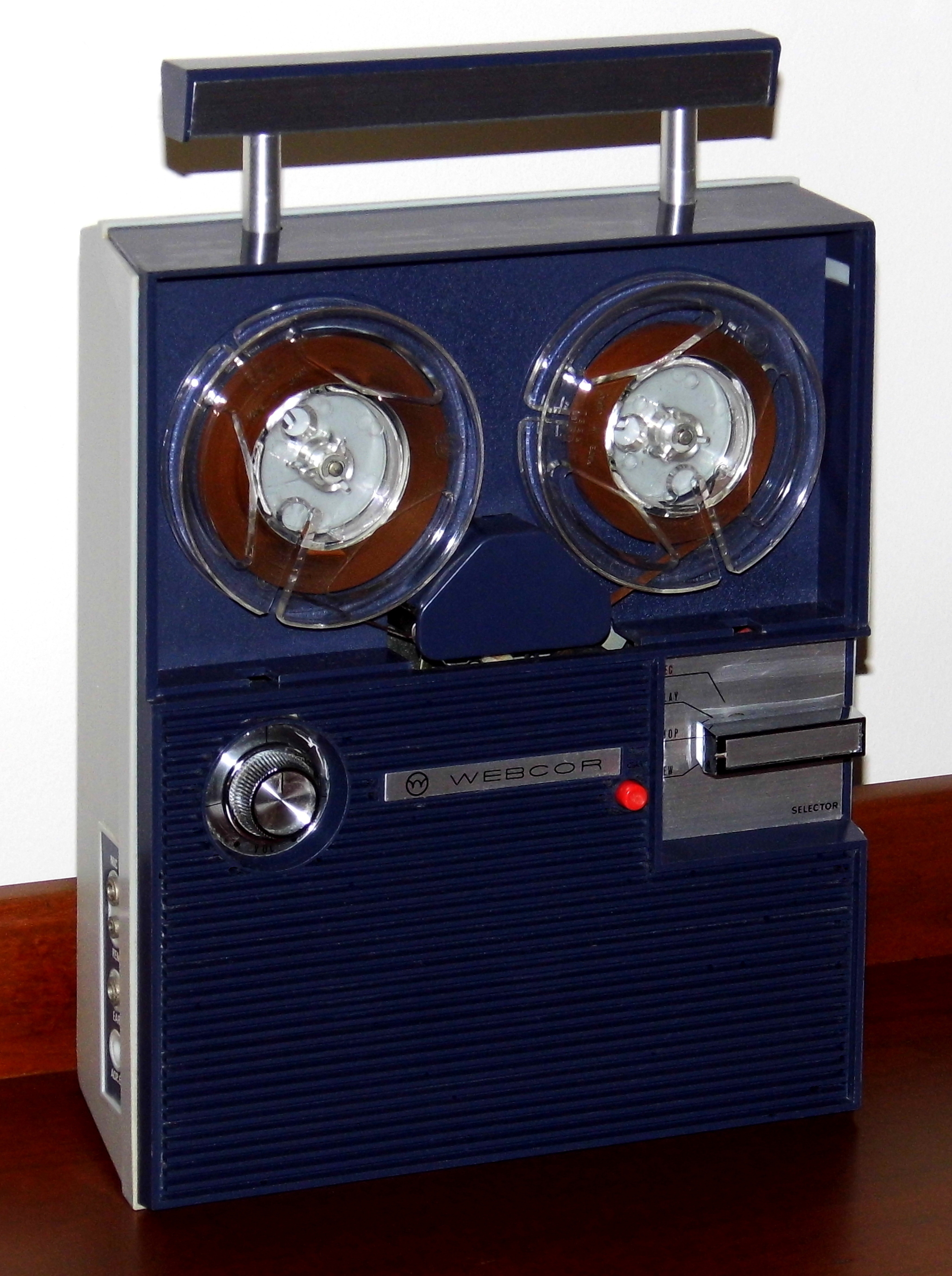 A portable reel-to-reel tape recorder of the type used to make audio recordings in the late 1960s and 1970s
