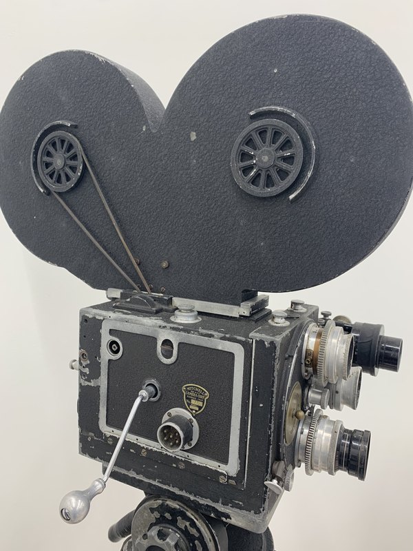 A vintage Mitchell 35mm motion-picture camera with a large film magazine